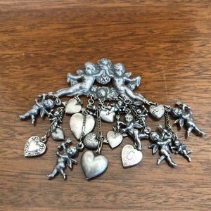 Vintage ornate angels and hearts brooch